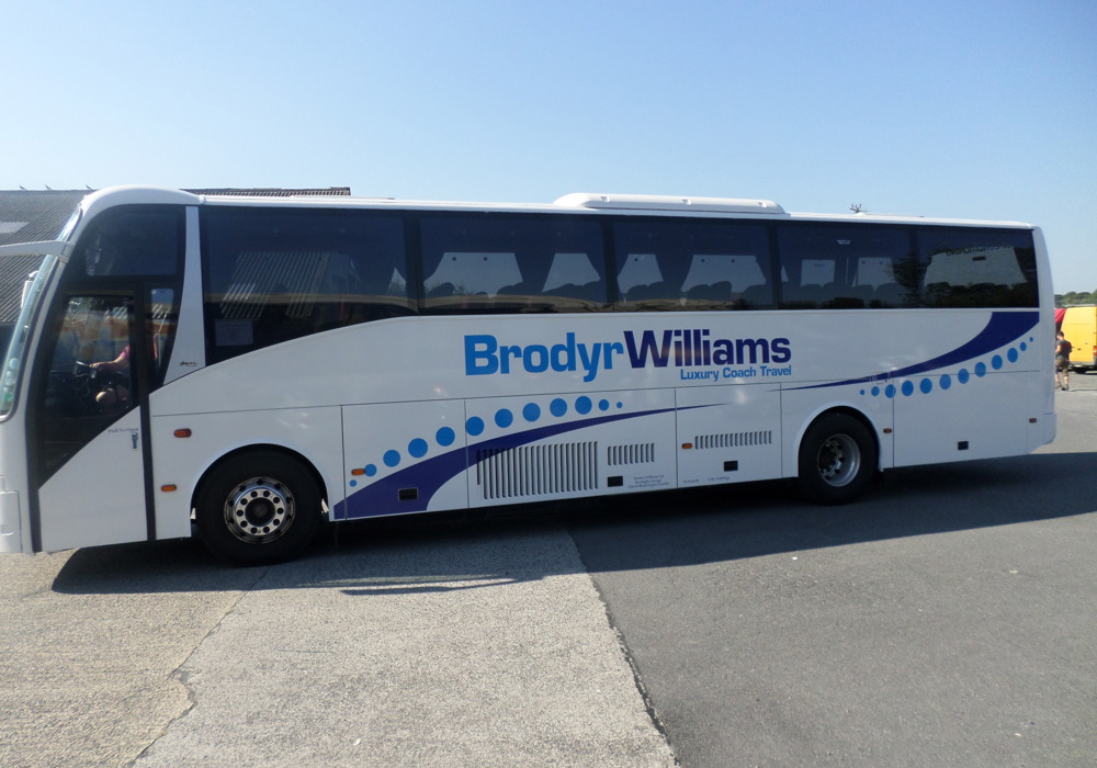 White coach with blue Brodyr Williams graphics