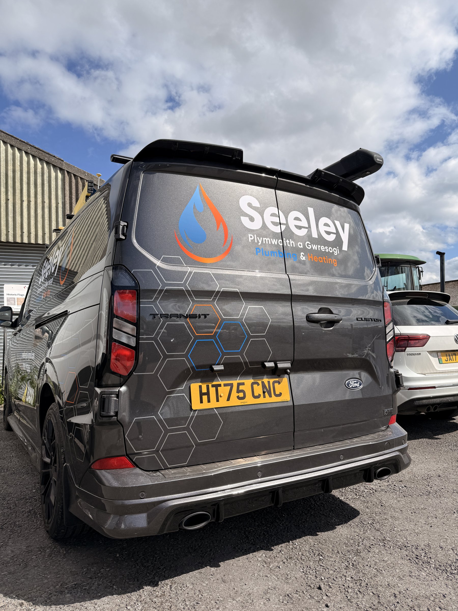 Seeley Plumbing and Heating vehicle graphics rear view