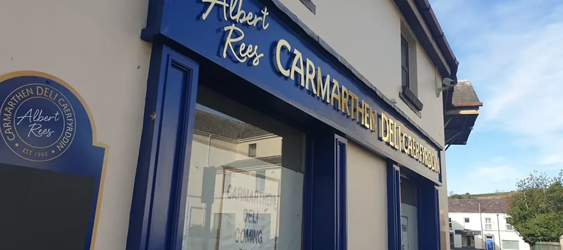 Shopfront with coordinated fascia and projecting signage produced by Eagle Signs